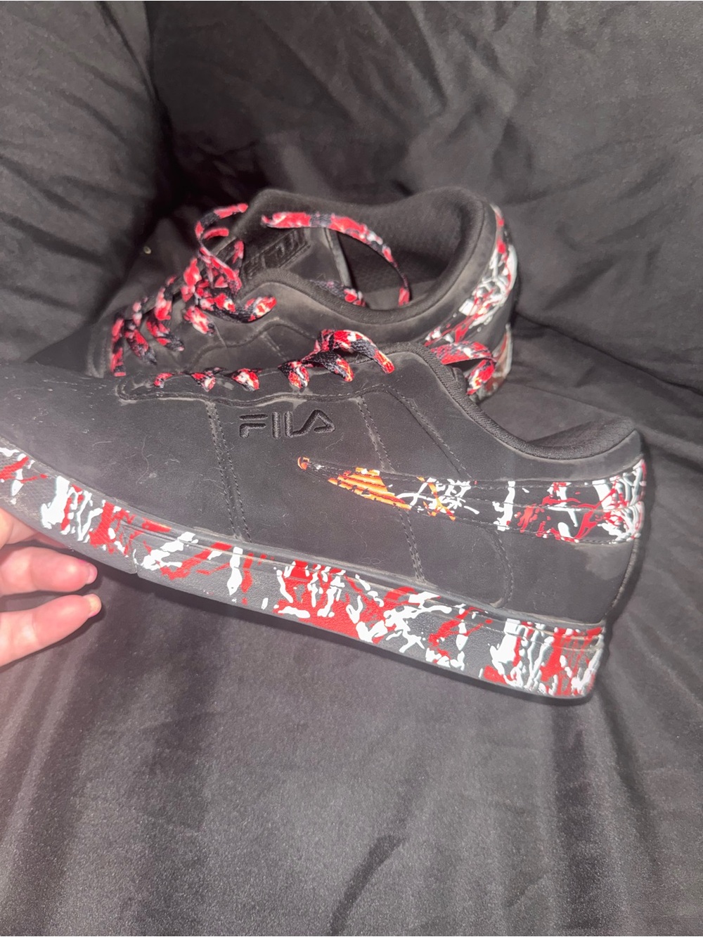 FILA Black Low-Top Sneakers with Red/White Paint-Splash Detail